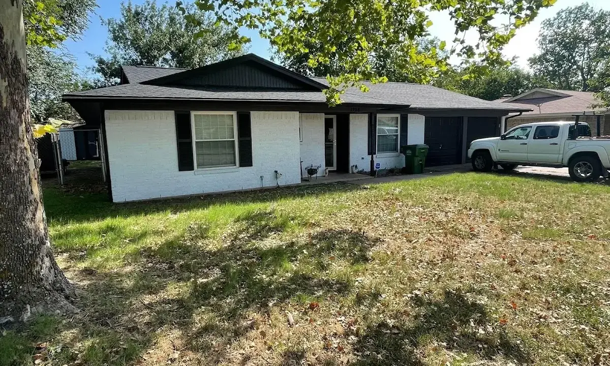 Professional roofing crew working on a residential roof in Aransas Pass